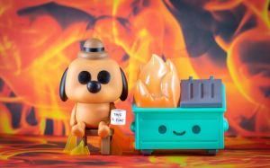 Toy version of the "It's fine" dog meme, with cute little flaming dumpster and all.